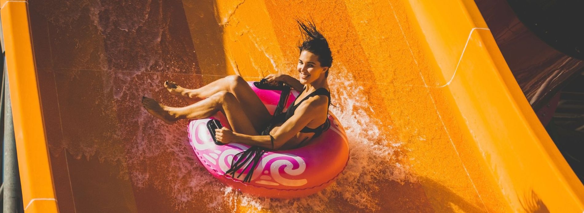 woman in tub on waterslide